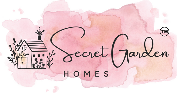 Logo of Secret Garden Homes with a watercolor background and house illustration.

